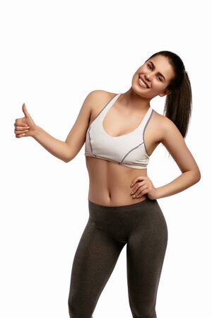 Happy sporty fitness woman on white backgroundの写真素材