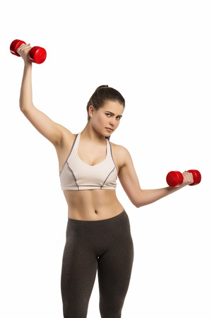 Happy sporty fitness woman on white backgroundの写真素材