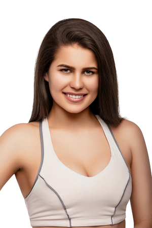 Happy sporty fitness woman on white background.の写真素材