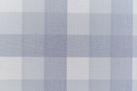 Paper Wallpaper on the wall vertical and horizontal blue stripes of different saturation. Texture...