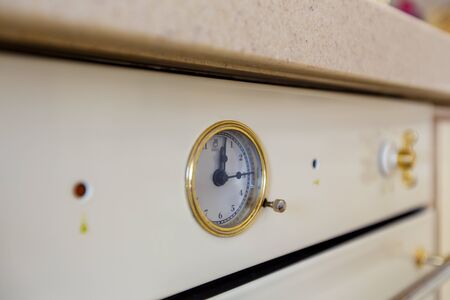 The upper part of The oven in the style of Provence. Arrow temperature indicator close-up, side...