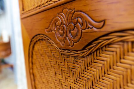 element of the back of a wooden antique chair made of dark wood close-up..