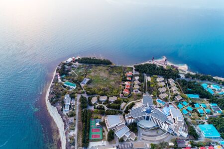 The black sea resort of Gelendzhik. ""Fat" Cape at sunset. The Gelendzhik lighthouse and a modern hotel are visible.の写真素材