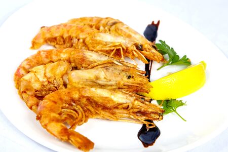 Langoustines on the grill. Plate on a white background.の写真素材