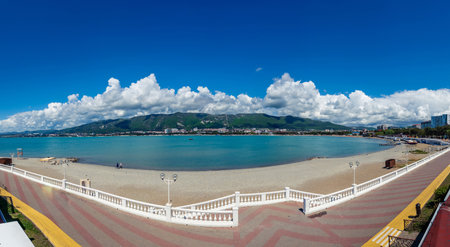 The sea promenade with a balustrade is a great place for walking on the background of the sea and mountains. High quality photoの写真素材