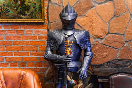 A snow covered plant with a few leaves still visible. The image has a serene and peaceful mood, as the snow covers the plant and the surrounding area, creating a calm and quiet atmosphereの写真素材