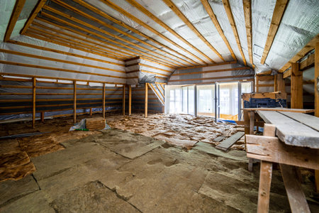 A room with a lot of wood and a lot of insulation. The room is empty and has a lot of space