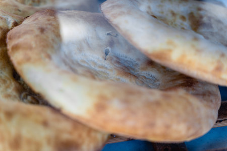 Fresh flatbreads are on counter. Tortillas are deliciously browned. Fresh pastries