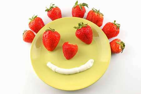 funny strawberries on a plateの写真素材