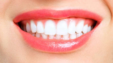 Perfect healthy teeth smile of a young woman. Teeth whitening. Dental clinic patient. Image symbolizes oral care dentistry, stomatologyの写真素材