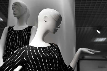 Stylish glamor female mannequin dressed in black dress