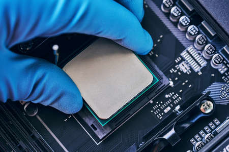 Electronic engineer of computer technology. Installing the processor on the motherboard. Pc repair,...