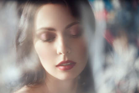 Portrait of a beautiful woman shot through the haze.の写真素材