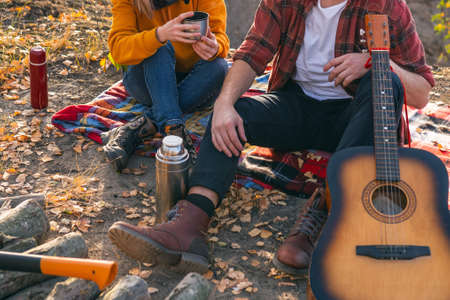 A couple are resting in nature, against the background of autumnの写真素材