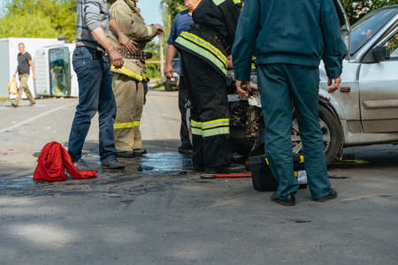 Rescuers rescue victims from a wrecked car 18.08.2020 Russia Nowomoskowskのeditorial素材