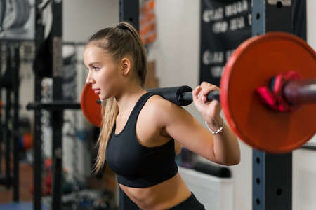 A young woman is engaged in fitness at the GYM.の写真素材