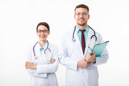 Happy doctors, man and woman isolated on whiteの写真素材