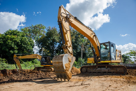 A large construction excavator of yellow color on the construction site in a quarry for quarrying....