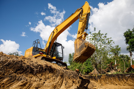 A large construction excavator of yellow color on the construction site in a quarry for quarrying. Industrial image.の写真素材