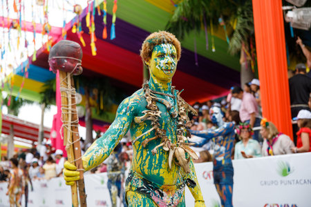 02.04.2023 Dominican Republic Punta Cana Annual Carnival. A man in a carnaval costume and mask.のeditorial素材