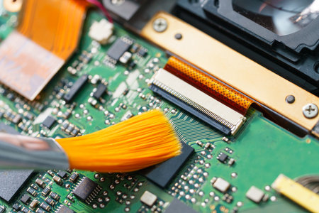 cleaning the electronic board with a brushの写真素材