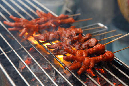 Grilled Chicken Feet on Skewers Traditional Filipino Street Foodの写真素材