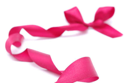 red satin ribbon on white with shallow dof