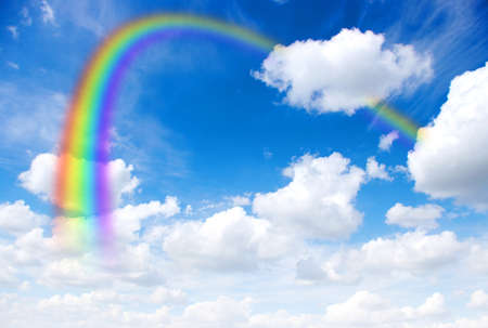A bright rainbow in the sky の写真素材