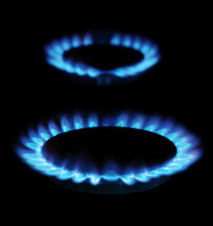  flames of gas stove in the dark    