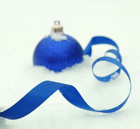 Christmas ball with snow isolated on white