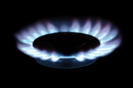  flames of gas stove in the dark    