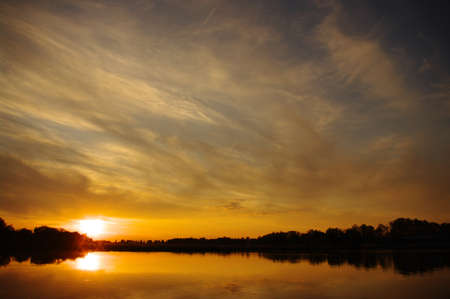 sunset at coast of the lakeの写真素材
