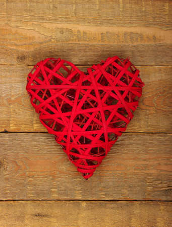 Red heart on a background of woodの写真素材