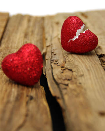 Broken heart on wood backgroundの写真素材
