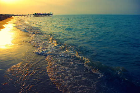 Blue sea and sun on sunsetの写真素材