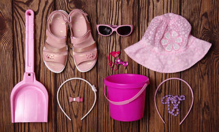 Summer accessories of girl on wooden backgroundの写真素材