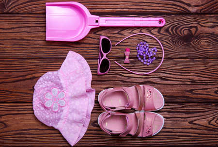 Summer accessories of kids on wooden backgroundの写真素材