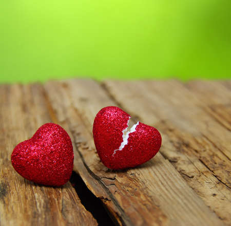 love concept. Broken heart cheating on wood and green  background.の写真素材