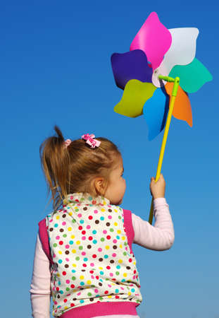 happy little girl on skyの写真素材