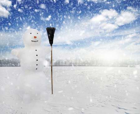 Snowman standing in winter landscapeの写真素材