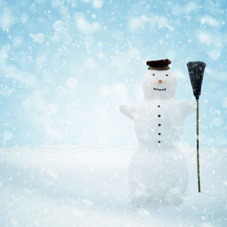 Snowman standing in winter christmas landscape. Snow backgroundの写真素材
