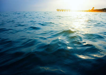 Blue sea and sun on sunset