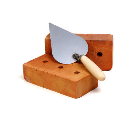 Brick and trowel on a white backgroundの写真素材
