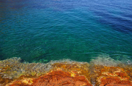 Landscape of the sea with rocks. Clear blue water in the bay.の写真素材