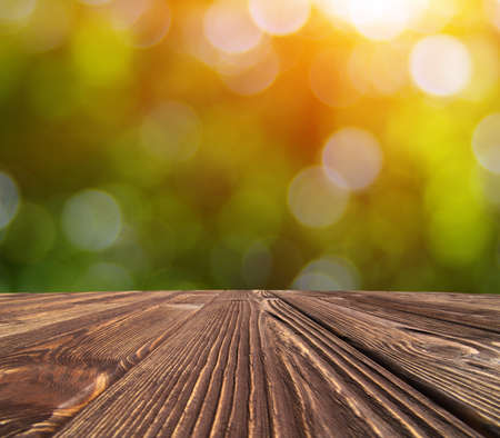 wooden table place and green blurred background