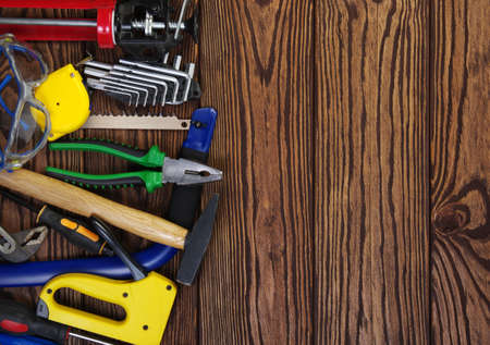 Tools on wood  background . Top view.