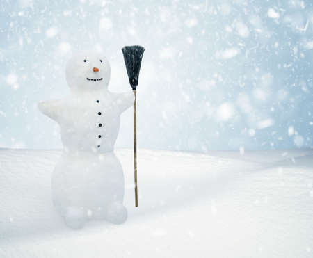 Snowman standing in winter christmas landscape. Snow backgroundの写真素材