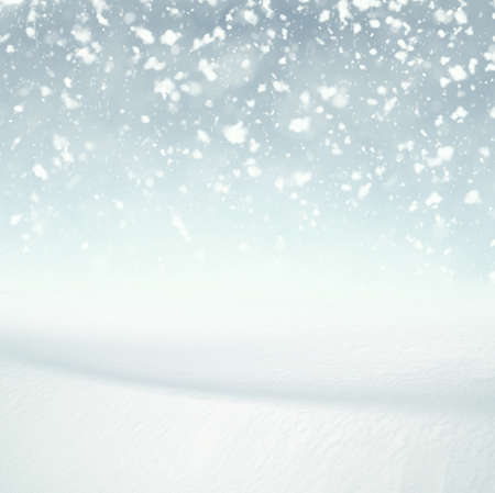 Winter background, falling snow over winter landscape with copy space