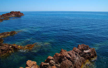 Landscape of the sea with rocks. Clear blue water in the bay.