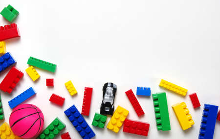 Kids toys frame on white background. Top view. Copy space for textの写真素材